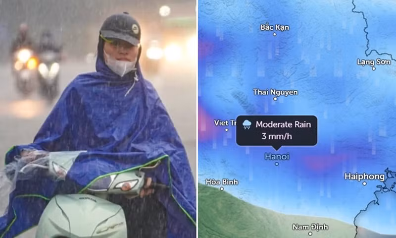 Người dân Hà Nội di chuyển dưới trời mưa