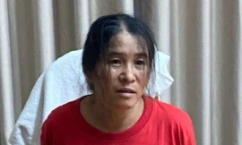 Lê Thị Chanh khi bị bắt ở TP HCM giữa đêm 12/12. Ảnh: Công an Bình Thuận