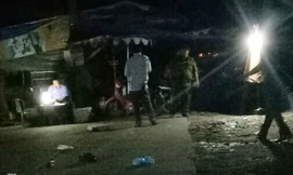 Cơ quan chức năng khám nghiệm hiện trường tối 29/10. Ảnh: Zing