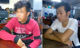 Nguyễn Đức Nhân (áo đỏ) và Lê Thanh H (áo trắng) tại cơ quan Công an.