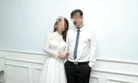 Bà Nguyễn Thị Ph. cùng chồng trước thời điểm xảy ra vụ việc