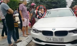 Bố dùng búa đập vỡ kính xe BMW để giải cứu con gái