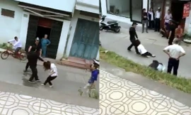 Cô gái bị túm tóc, kéo lê dưới đường. Ảnh cắt từ clip