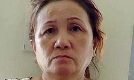 Bà Sương lúc bị bắt. Ảnh: Nguyệt Triều