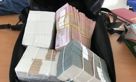 Số tiền của vụ cướp mà công an thu được. Ảnh: C.A. 