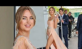 Mẫu nội y Kimberley Garner liên tục che chắn vì váy xẻ cao 'bất tận'