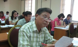 Chấm thi ở trường ĐH Khoa học Tự nhiên (ĐHQG HN) Ảnh : Hồ Thu