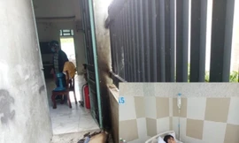 Một phụ nữ bị đánh nhập viện, nhà bị tưới xăng đốt