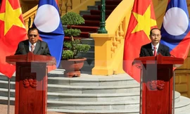 Chủ tịch nước Trần Đại Quang và Tổng Bí thư, Chủ tịch nước Lào Bounnhang Vorachith đồng chủ trì buổi họp báo kết thúc Năm đoàn kết hữu nghị Việt Nam-Lào, Lào-Việt Nam. Ảnh: Nhan Sáng/TTXVN.