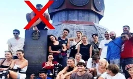 Xác minh vụ khách nước ngoài ngồi lên tấm bia khắc hình Quốc huy ở Hà Giang