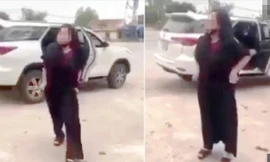 Hành động lột đồ chửi bới của bà M. trước cổng đền Cuông khiến dư luận bức xúc