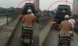 Xe cứu hộ chở ô tô qua cầu Long Biên bất chấp biển cấm