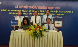 Lễ ký kết giữa Sacombank và VMAC chiều 25/9 xác lập việc xử lý nợ xấu theo nghị quyết 42 