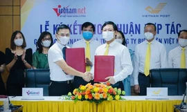 Lễ ký thỏa thuận hợp tác giữa Tổng Công ty Bưu điện Việt Nam (Vietnam Post) và Báo VietNamNet