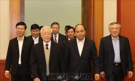 Tổng Bí thư, Chủ tịch nước Nguyễn Phú Trọng, Thủ tướng Nguyễn Xuân Phúc và Thường trực Ban Bí thư Võ Văn Thưởng đến dự buổi gặp mặt. Ảnh : Trí Dũng - TTXVN