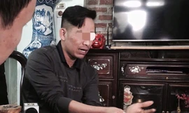 Ông L. trần tình việc bị con trai tố đánh bằng dây điện. Ảnh: Thanh Hà.