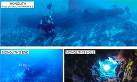 Khối đá bị vỡ đôi thành 2 phần riêng biệt (trên) và có 3 lỗ khoan (trái và phải, bên dưới).