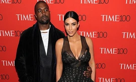 Cô Kim 'siêu vòng ba' mặc váy xẻ ngực cùng chồng đi dự tiệc