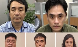 Ông Trần Hùng cùng một số bị can trong vụ án sách lậu.