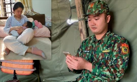 Đại úy Lê Ngọc Dũng trò chuyện với vợ con (ảnh nhỏ) qua điện thoại từ chốt chống dịch