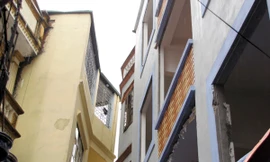 Thần đèn giải cứu hai nhà cao tầng bị nghiêng lún