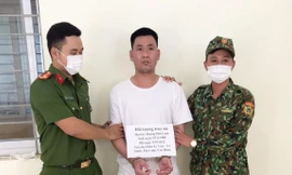 Đối tượng Hoàng Phú Lam (giữa) -Ảnh: TL