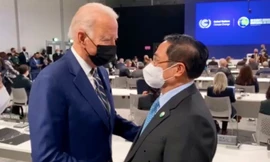 Thủ tướng Phạm Minh Chính trong cuộc gặp Tổng thống Mỹ Joe Biden bên lề hội nghị khí hậu tại Anh vào tháng 11/2021. (Ảnh: TTXVN)