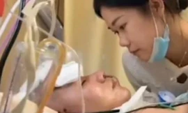 Chị Nie bên người chồng hôn mê