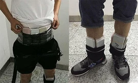 Hàng trăm chiếc iPhone 7 được quấn quanh người để nhập lậu vào Trung Quốc.