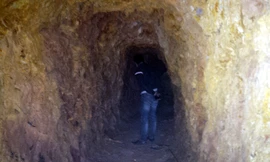 Đường hầm xuyên qua núi được ông Liếc cho người đào từ năm 2009 đến nay. Ảnh: Tiến Hùng.