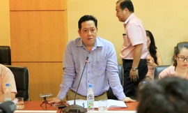 Ông Nguyễn Xuân Quang trả lời báo chí. Ảnh: Trường Phong