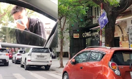 Điểm trông xe phố Thái Phiên với biển cấp phép xô lệch và nhân viên thò đầu qua cửa kính ô tô (ảnh nhỏ) yêu cầu chủ xe trả 70.000 đồng/lượt Ảnh: A.Trọng 