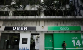 Một góc văn phòng của Uber và Grab chụp vào ngày 26/3/2018. Ảnh: Reuters