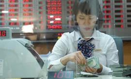 Phiên 13/9 ghi nhận trên thị trường liên ngân hàng tỷ giá chốt phiên ở mức 23.258 VND/USD, giảm tới 18 VND so với phiên 12/9 - Ảnh: Quang Phúc