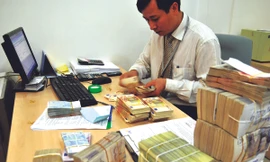 Bao nhiêu tiền để có thể mua hết nợ xấu? Ảnh: Hồng Vĩnh