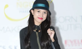 Vân Hugo mặc cả cây đen kín mít đi dự tiệc