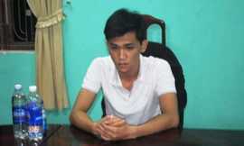 Nguyễn Hữu Quang tại cơ quan công an.