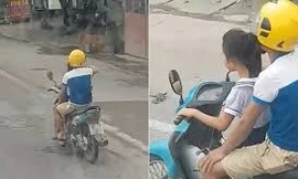 Bố để bé gái lái xe máy phóng như bay trên đường