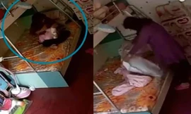 Bảo mẫu đánh đập, dùng chăn quấn quanh đầu bé gái rồi nhấc bổng