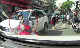 Nữ 'ninja' sang đường như đi trong sân, va vào ô tô ngã dúi dụi