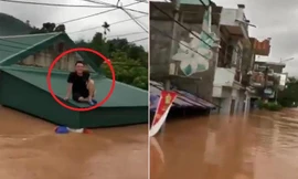 Dân Quảng Ninh đi xuồng máy, ngồi trên nóc nhà nhìn nước lũ bao vây