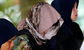 Đoàn Thị Hương đến toà sáng nay, 16/8. Ảnh: Reuters