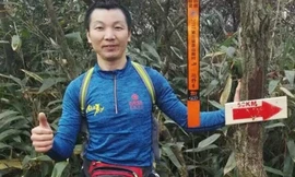 Pan Shancu dừng ven đường chụp ảnh khi đang chạy bộ về quê ăn Tết. Ảnh: SCMP