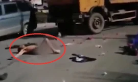 Hình ảnh chàng trai khỏa thân lăn lộn trên đường được cắt ra từ đoạn video.