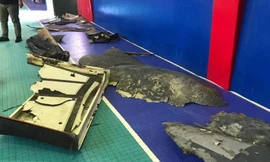 Mảnh vỡ được cho là của máy bay không người lái Mỹ. Ảnh: AFP