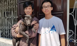 Anh Tâm và con trai Hữu Thiện cùng chú chó Net