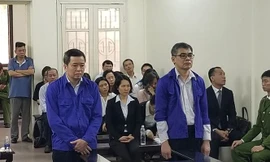 Từ trái qua, các bị cáo Võ Quang Huy, Từ Thành Nghĩa.