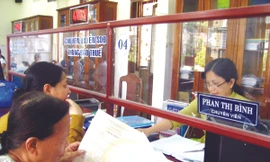 Người dân sẽ không còn mất nhiều thời gian đi lại làm TTHC tại “một cửa” Ảnh: Nam Cường