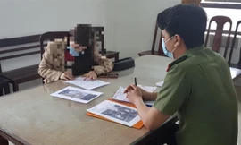 Bà T.T.N.M tại buổi làm việc với cơ quan công an. 