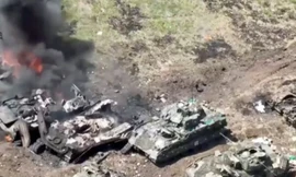 Hình ảnh từ video cho thấy những chiếc xe chiến đấu bị phá hỏng